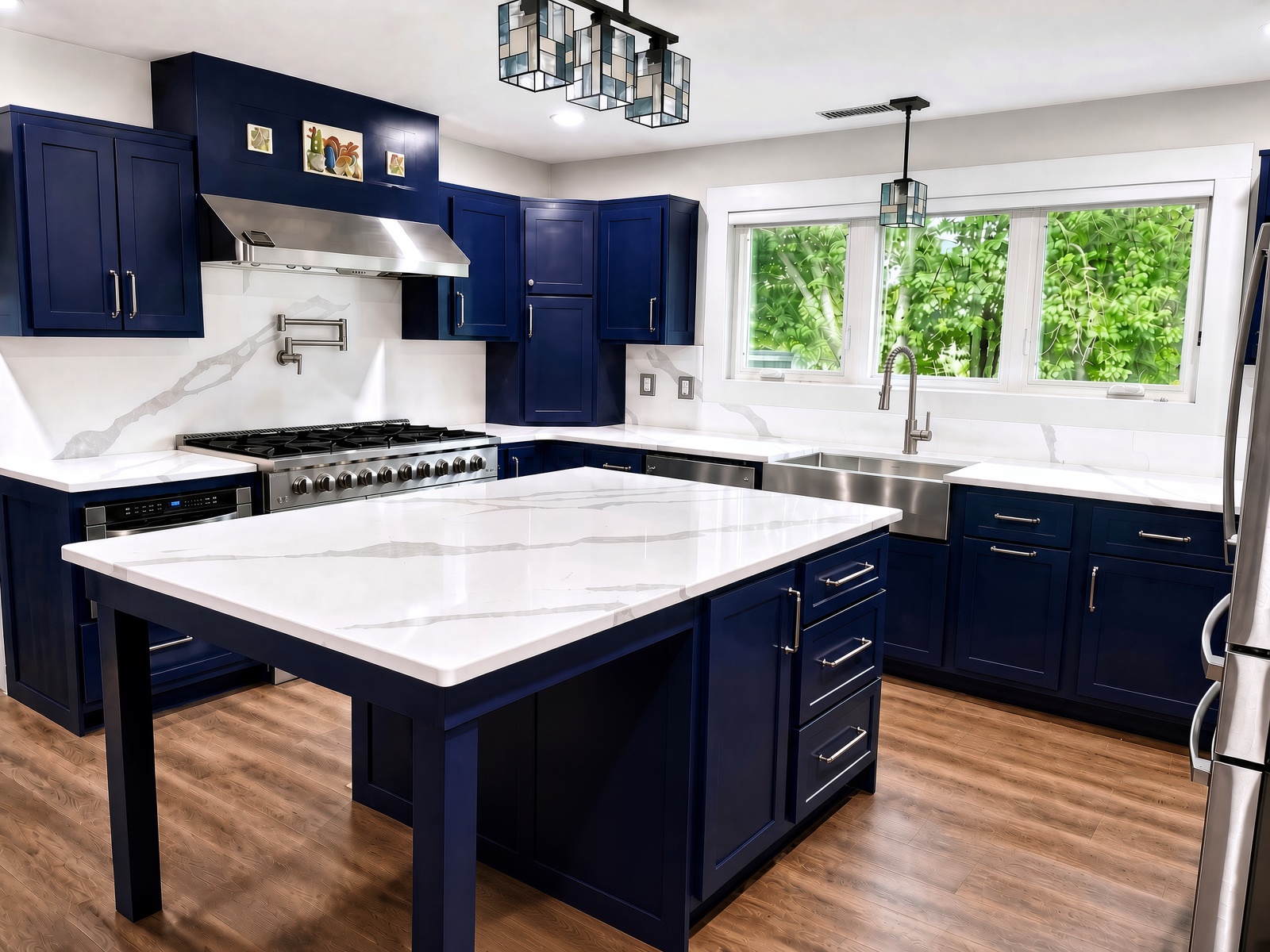 Calacatta Leon quartz island over navy cabinetry